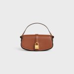 CLUTCH ON STRAP TABOU IN SMOOTH CALFSKIN TAN
